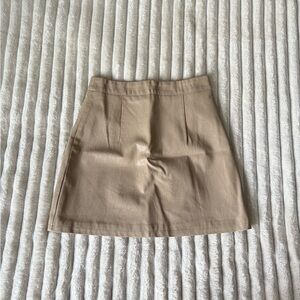 Tan/beige mini skirt from Princess Polly in a size 2